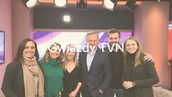 Group of popular Polish TV personalities from TVN, smiling and posing together, studio lighting, professional and glamorous, modern.