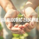 Two hands holding a delicate seedling, symbolizing trust growth, soft warm sunlight, earthy tones, subtle blurred garden background, minimalist composition, realistic.